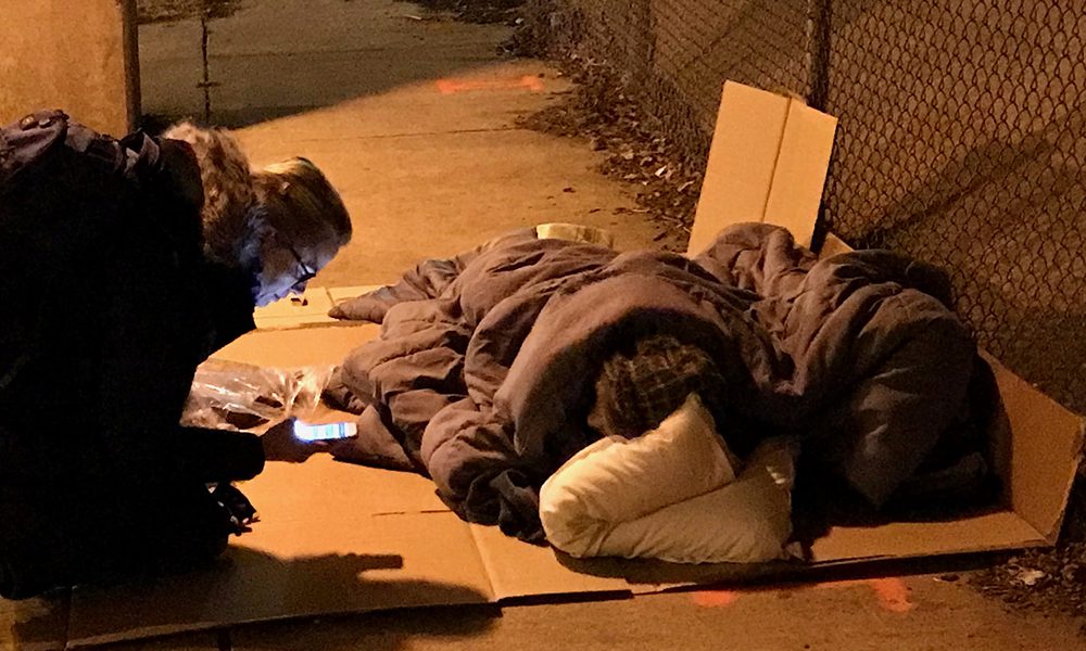 Volunteer interviews homeless residents for 2018 point-in-time count, January 31. Photo: Peter Safir