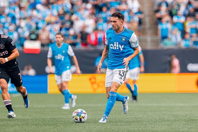 Bronico advancing the ball during a match