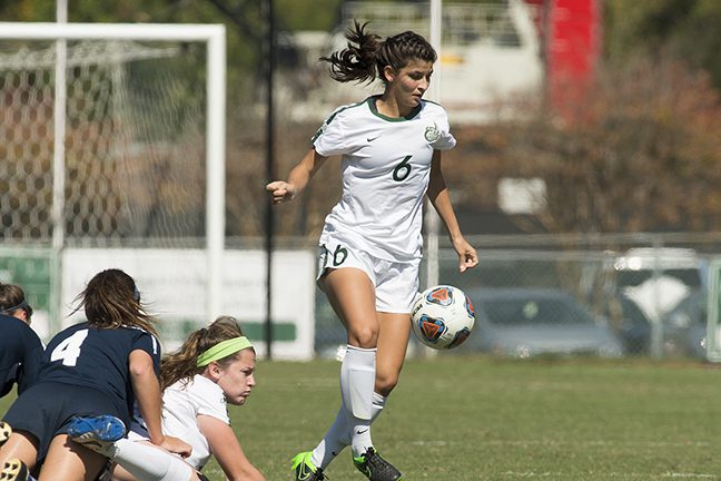 Rebecca Bronico kicking the soccer ball at Charlotte