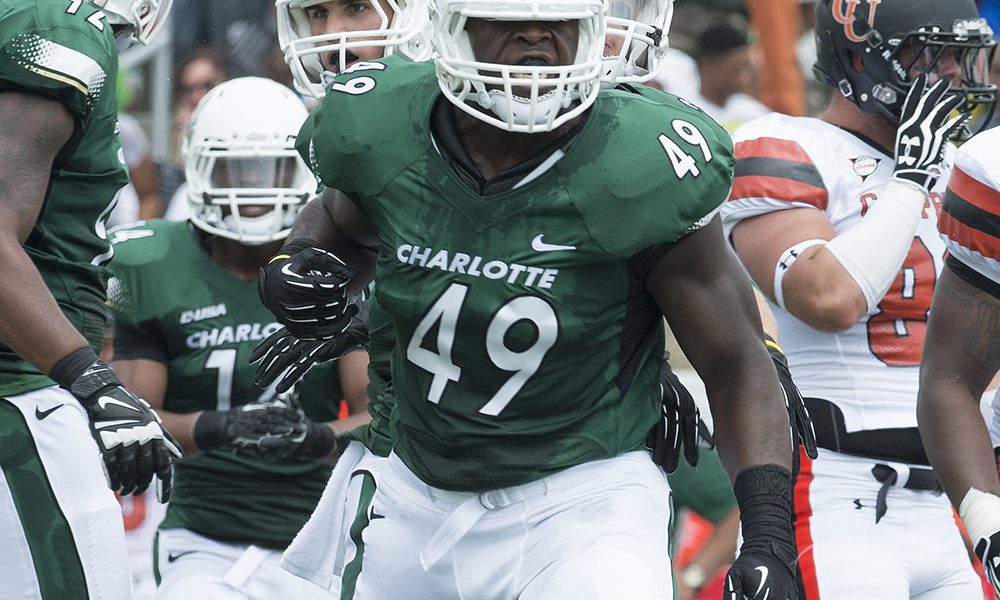 Larry Ogunjobi wearing No. 49 jersey during inaugural football game