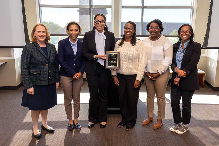 Troyer with Watson's graduate students